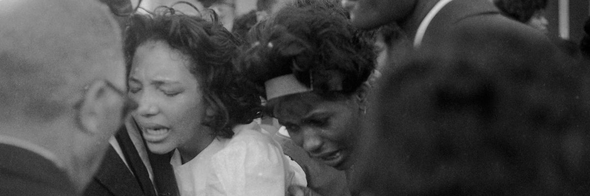 Relatives grieve at a 1963 funeral for a victim of 16th Street Baptist Church bombing in Birmingham, AL                           la