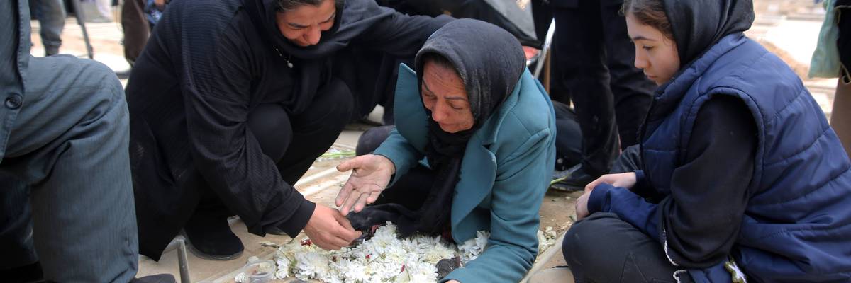 Relatives mourn as a funeral ceremony is held for people killed by US-Israeli airstrikes