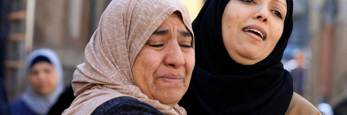 Relatives mourn at the funeral of one of the Palestinians killed during an Israeli raid 