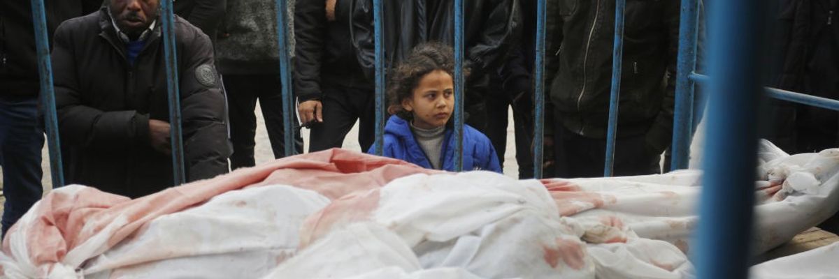 Relatives of Palestinians killed in the Israeli war on Gaza mourn