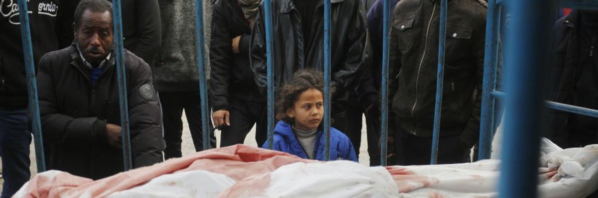 Relatives of Palestinians killed in the Israeli war on Gaza mourn