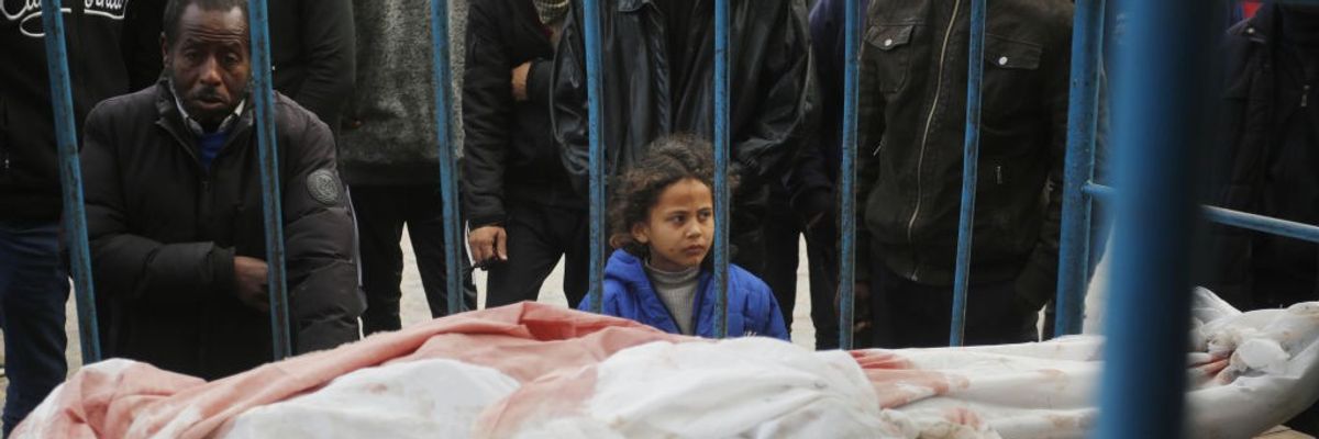 Relatives of Palestinians killed in the Israeli war on Gaza mourn
