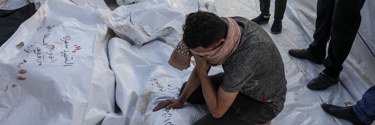 Relatives of Palestinians who were killed in an Israeli attack mourn