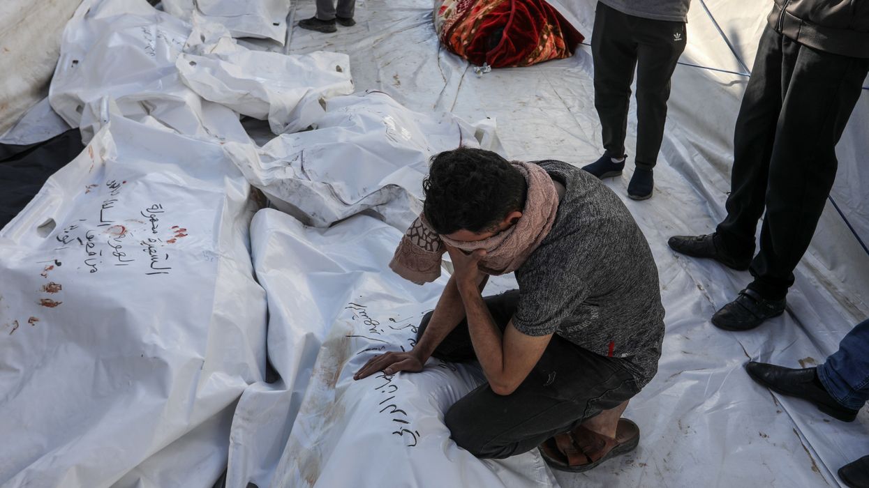 Relatives of Palestinians who were killed in an Israeli attack mourn