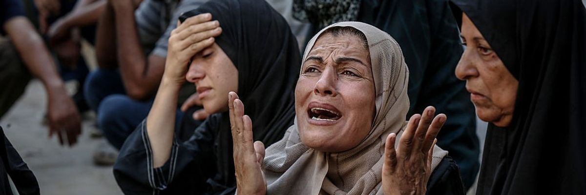 Relatives of the Palestinians killed in various Israeli attacks mourn
