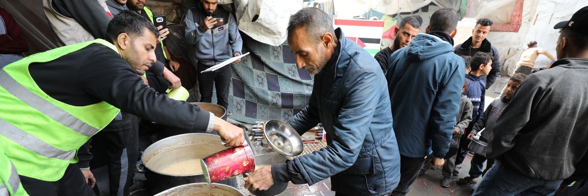 Relief workers distribute food in Gaza City
