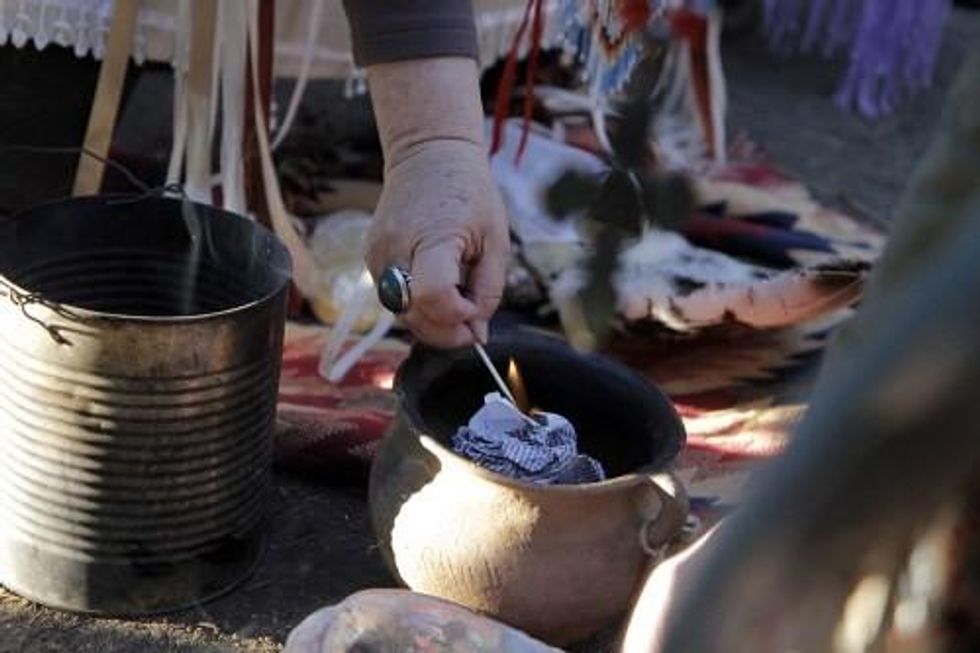 Religious leaders representing Episcopalians, Lutherans, Presbyterians, Baptists and others read their faith's repudiations of the Doctrine of Discovery. Then they gave a copy of the 15th-century document that gave Christian explorers the right to claim the lands they discovered to elders in Oceti Sakowin Camp and asked them to burn it.