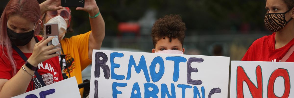 "Remote learning saves lives" sign