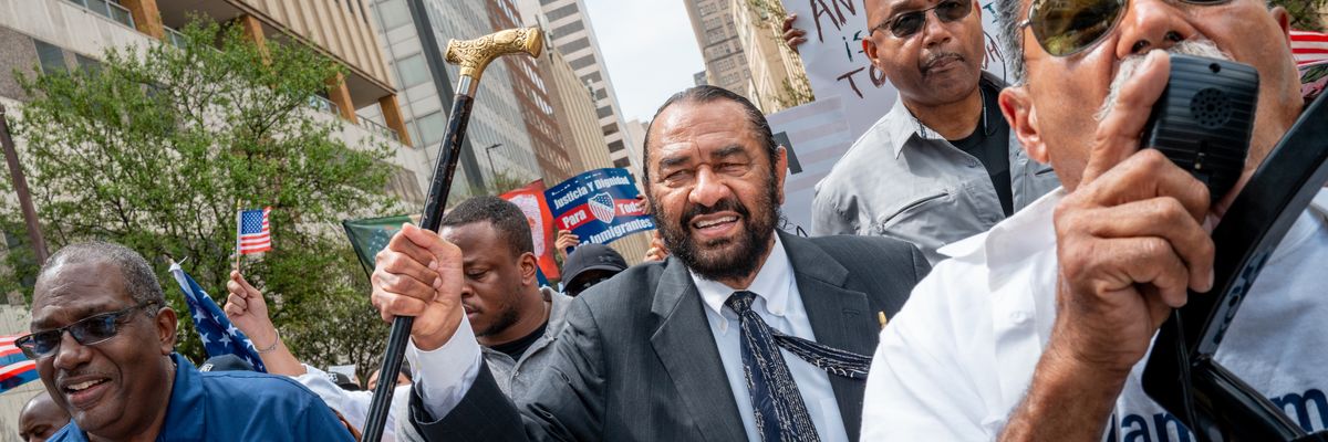 Rep. Al Green marches as part of a protest