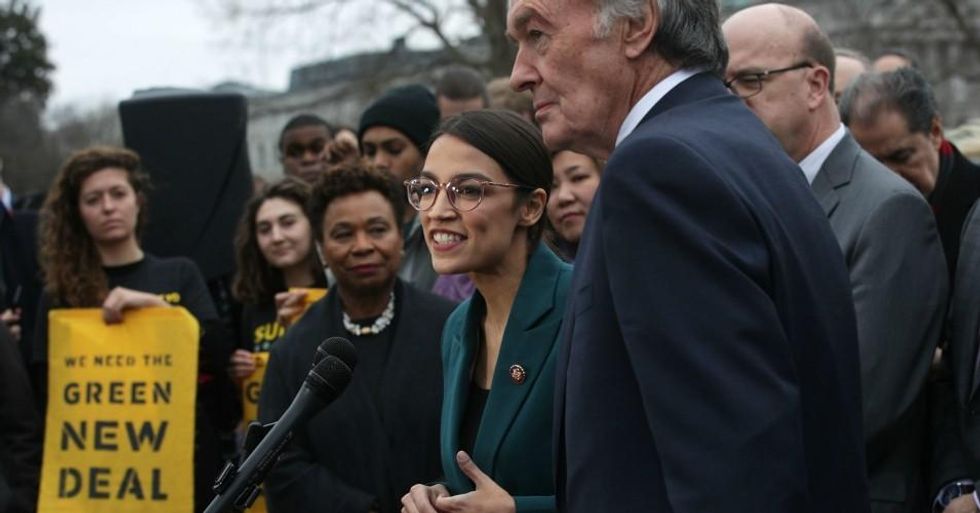 Rep. Alexandria Ocasio-Cortez (D-N.Y.) speaks as Sen. Ed Markey (D-Mass.) and other congressional Democrats listen during a news conference in front of the U.S. Capitol February 7, 2019 in Washington, D.C. (Photo: Alex Wong/Getty Images)