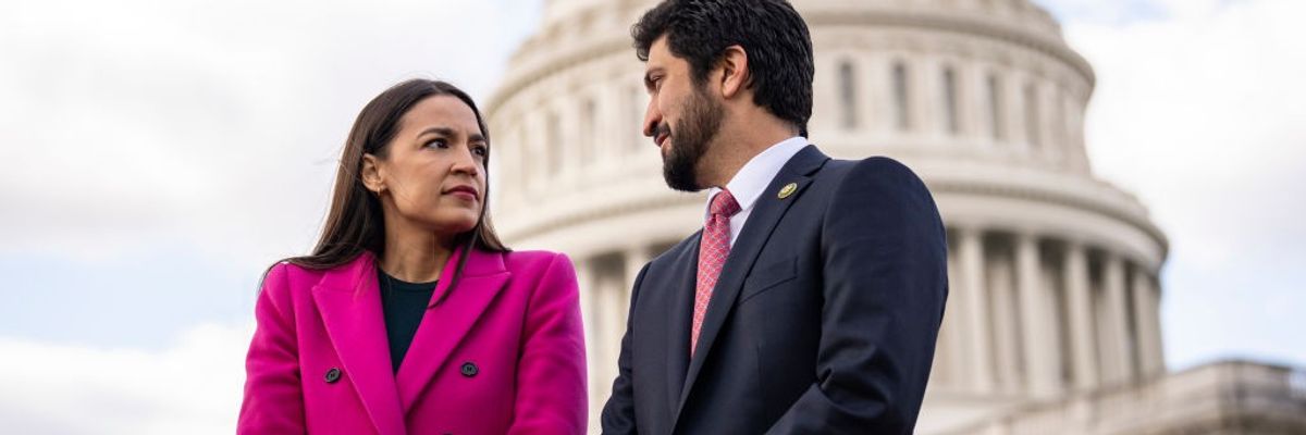 Rep. Alexandria Ocasio-Cortez speaks with Rep. Greg Casar outside the U.S. Capitol