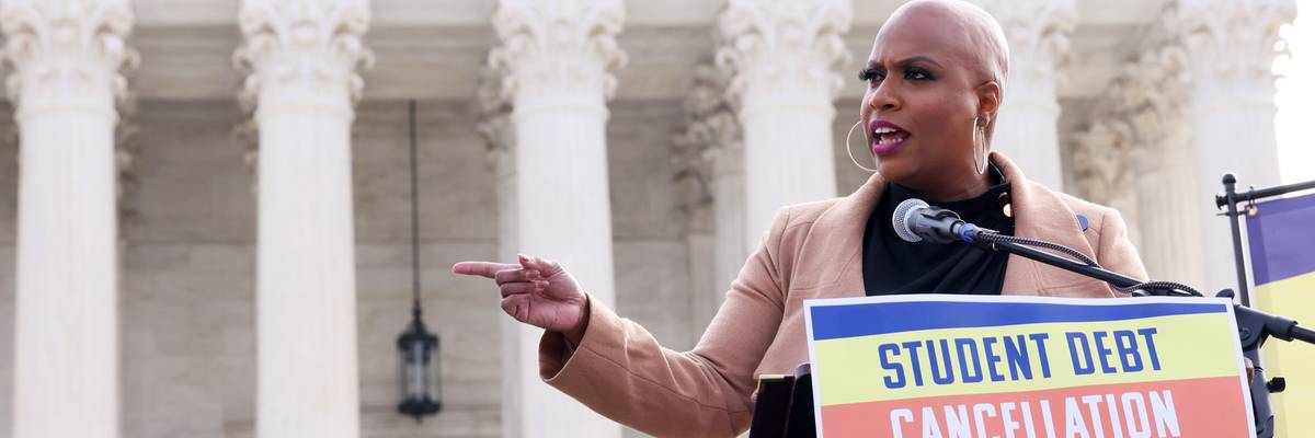 Rep. Ayanna Pressley speaks at a rally with student loan borrowers