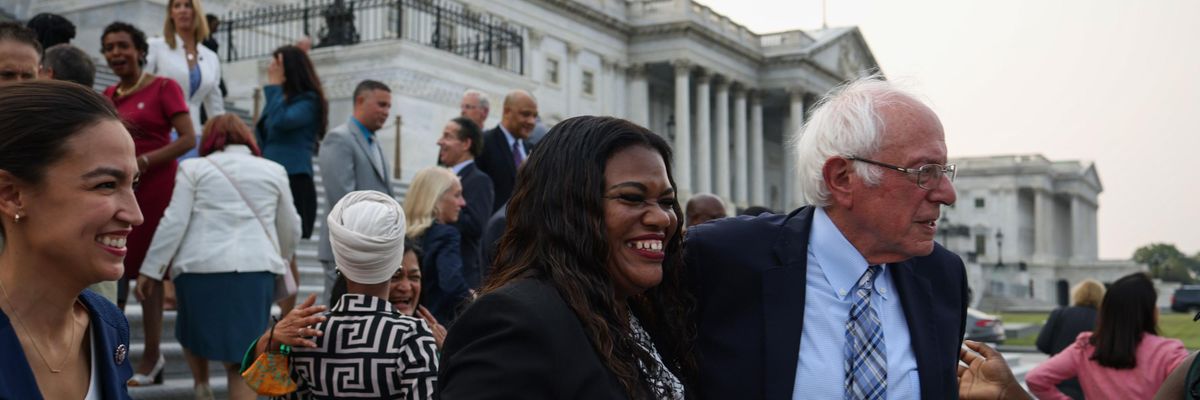 Rep. Cori Bush and Sen. Bernie Sanders attend an event