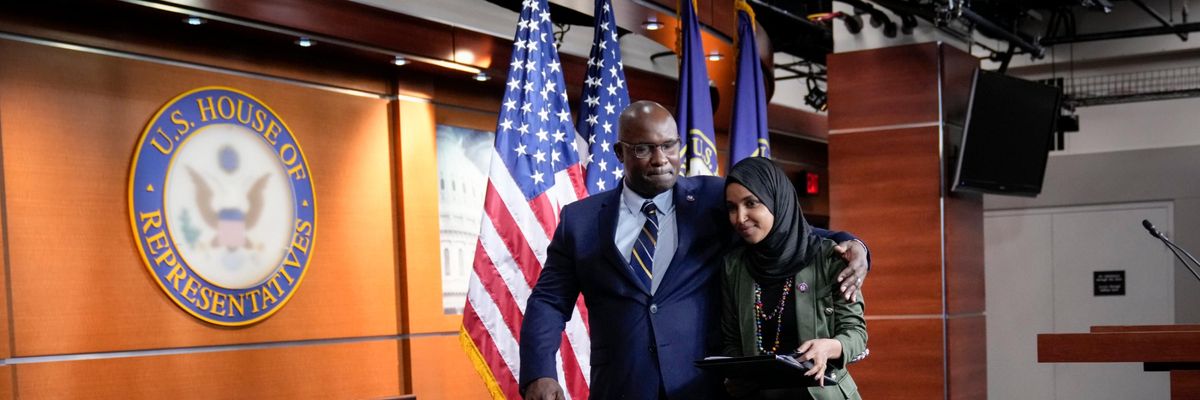 Rep. Jamaal Bowman and Rep. Ilhan Omar walk after a press conference.