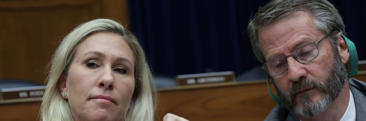 Rep. Marjorie Taylor-Greene (R-Ga.) fist-bumps Rep. Tim Burchett (R-Tenn.)