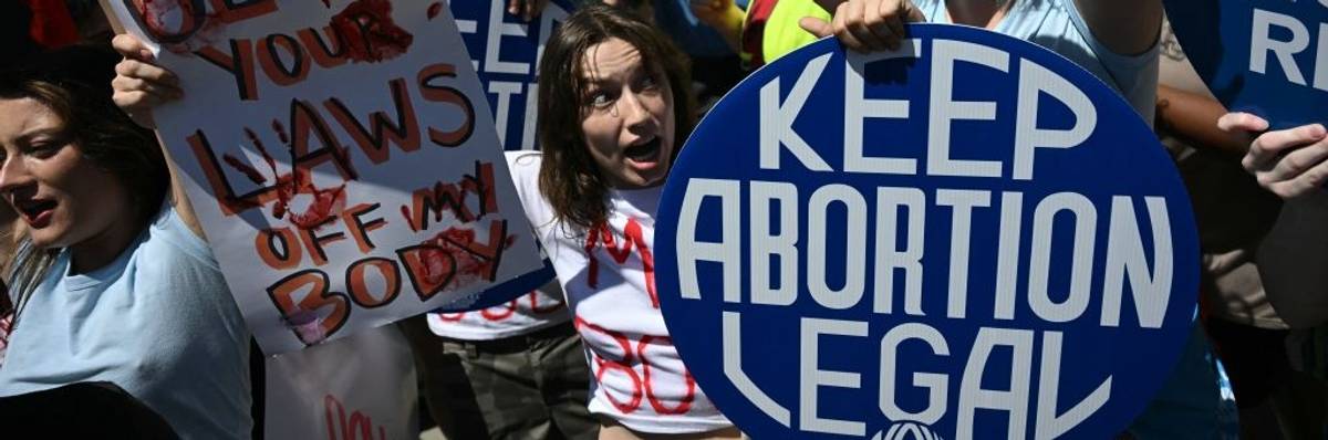 Reproductive rights activists demonstrate in front of the U.S. Supreme Court