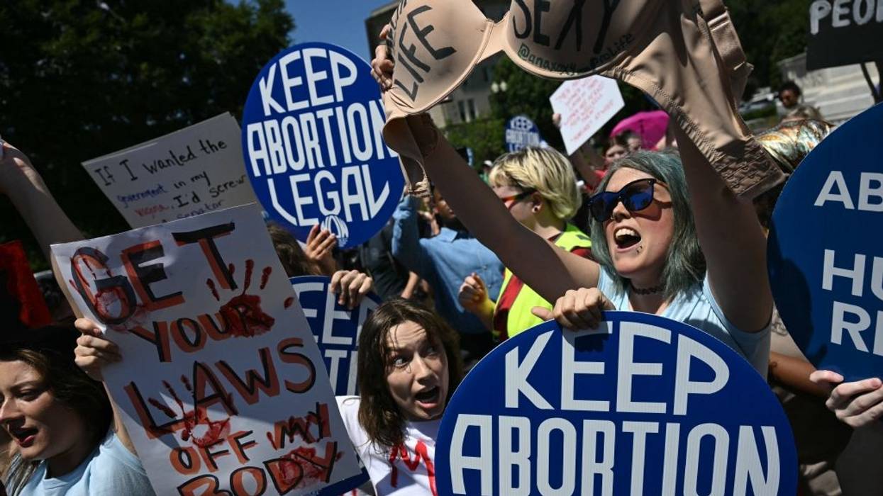 Reproductive rights activists demonstrate in front of the U.S. Supreme Court