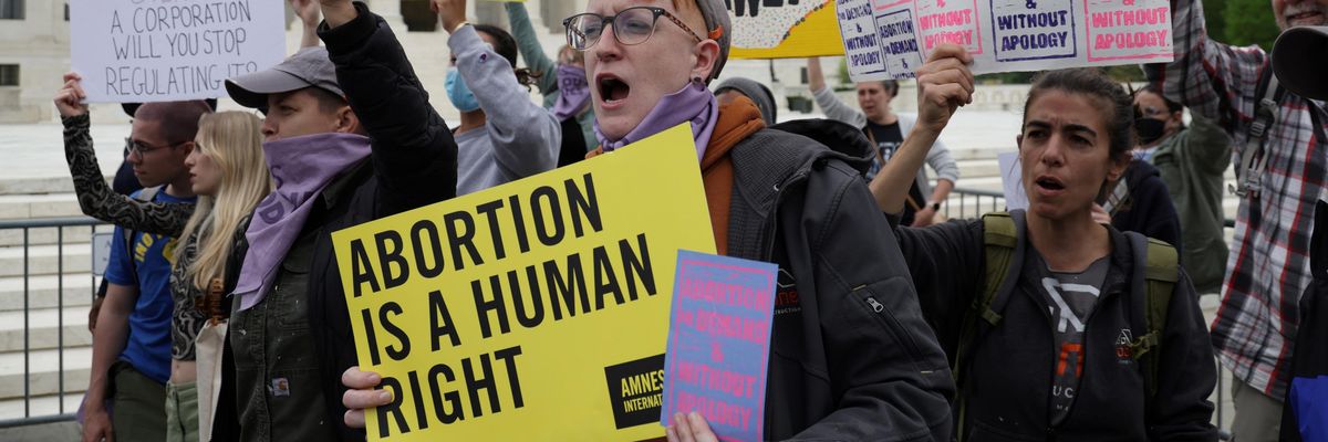 Reproductive rights advocates protest in response to the leaked Supreme Court draft decision to overturn Roe v. Wade on May 3, 2022 in Washington, D.C.