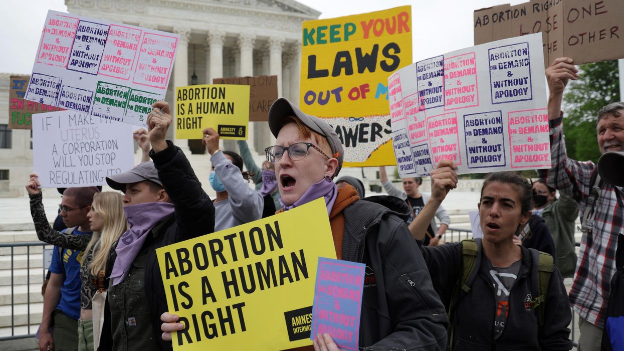Reproductive rights advocates protest in response to the leaked Supreme Court draft decision to overturn Roe v. Wade on May 3, 2022 in Washington, D.C.