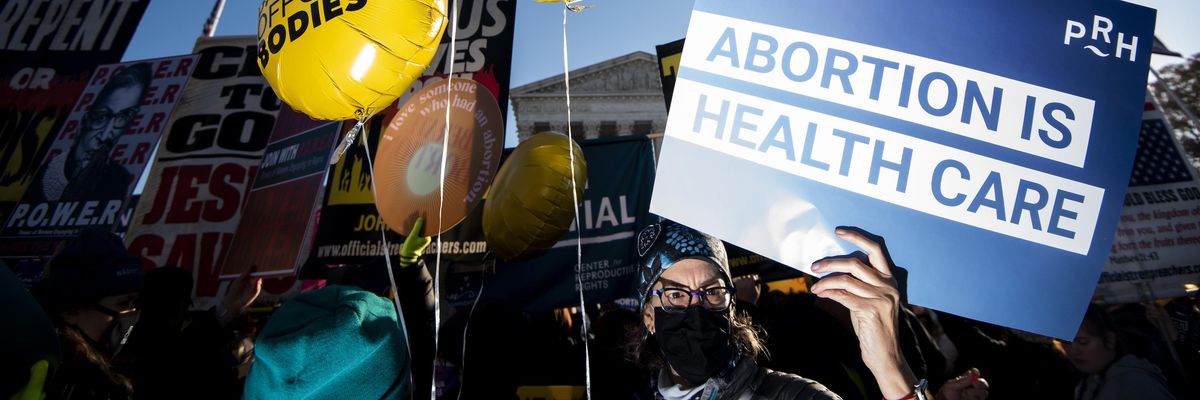Reproductive rights and anti-choice protesters rally outside the U.S. Supreme Court before the start of oral arguments in Dobbs v. Jackson Women's Health Organization case on December 1, 2021