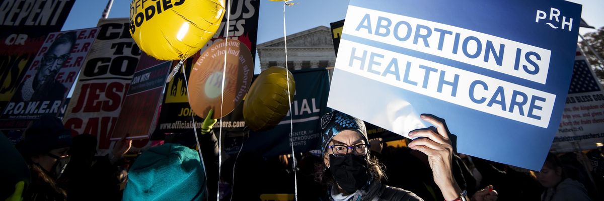 Reproductive rights and anti-choice protesters rally outside the U.S. Supreme Court before the start of oral arguments in Dobbs v. Jackson Women's Health Organization case on December 1, 2021