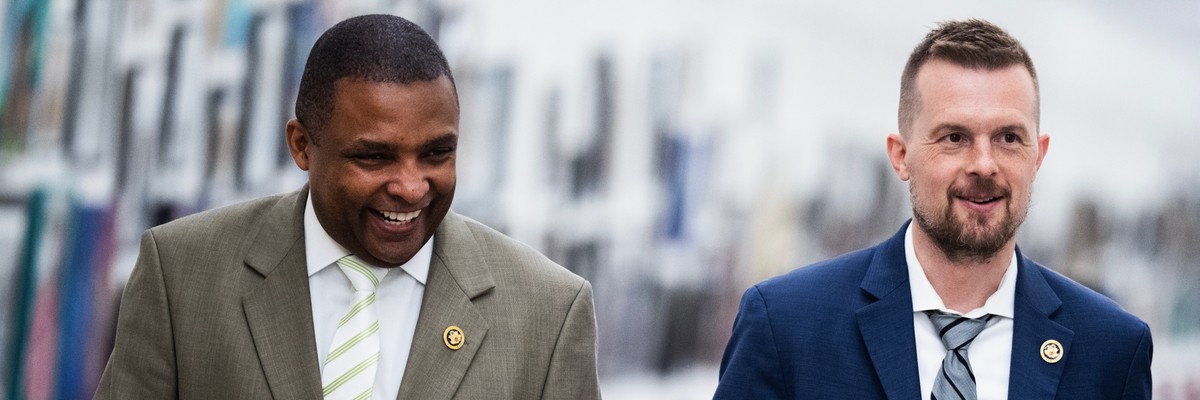 Reps. Jared Golden, right, and Don Davis