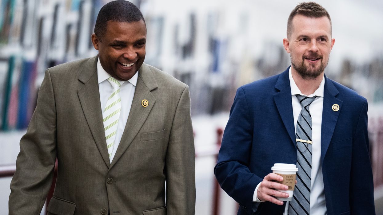 Reps. Jared Golden, right, and Don Davis