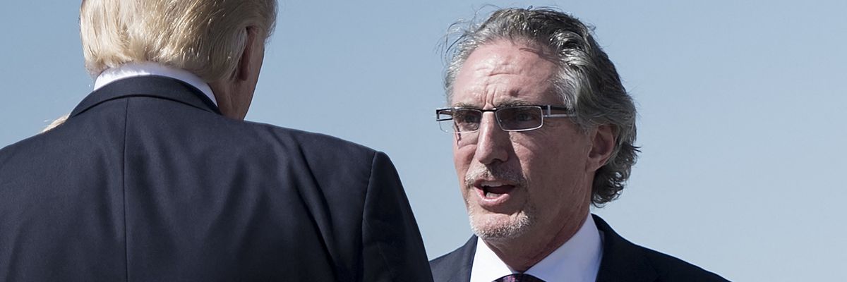 Republican North Dakota Gov. Doug Burgum greets then-U.S. President Donald Trump at Bismarck Municipal Airport on September 6, 2017.