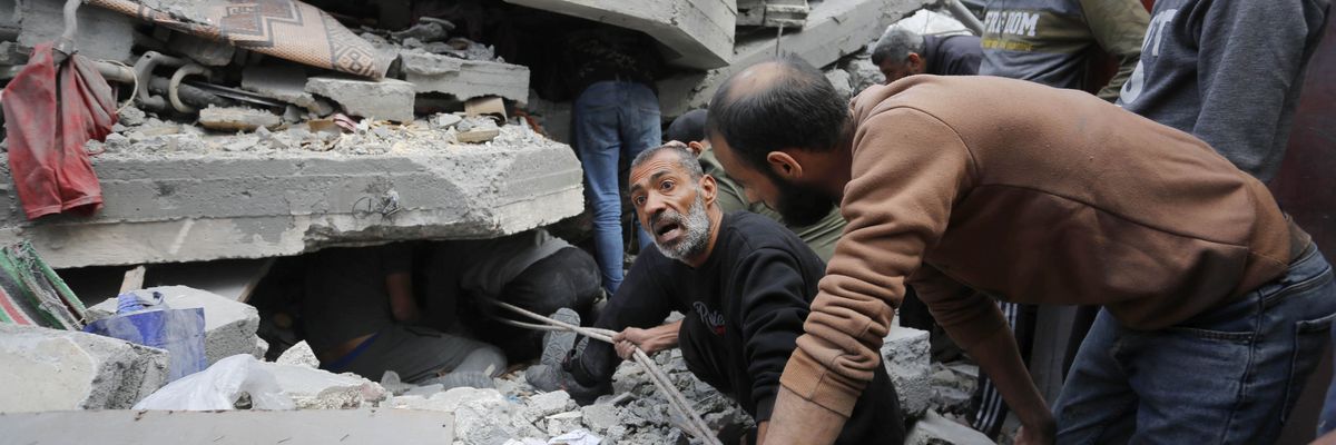 Rescue teams search rubble of Gaza building