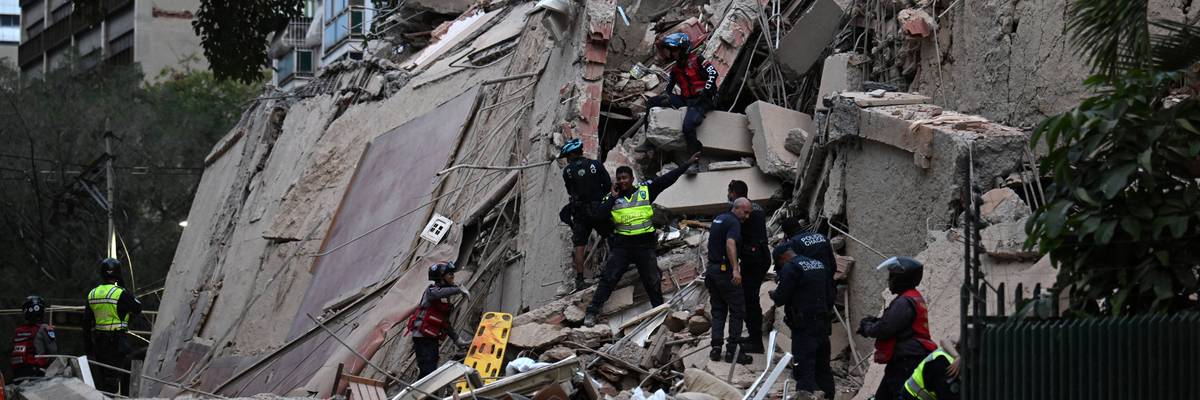 Rescue workers search for survivors of a massive earthquake in Venezuela