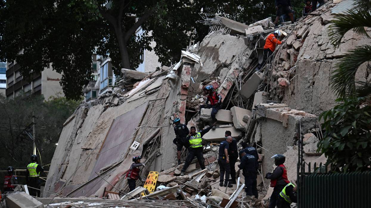 Rescue workers search for survivors of a massive earthquake in Venezuela