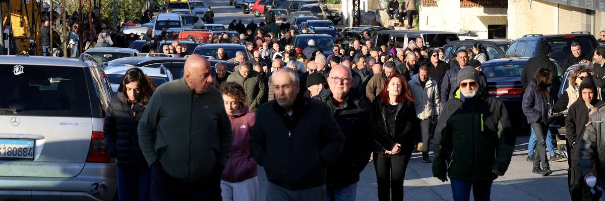 Residents in Al-Qlayaa, Lebanon march toward the municipality hall to show their anger over the killing of the town's pastor