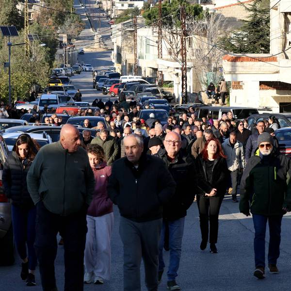 Residents in Al-Qlayaa, Lebanon march toward the municipality hall to show their anger over the killing of the town's pastor