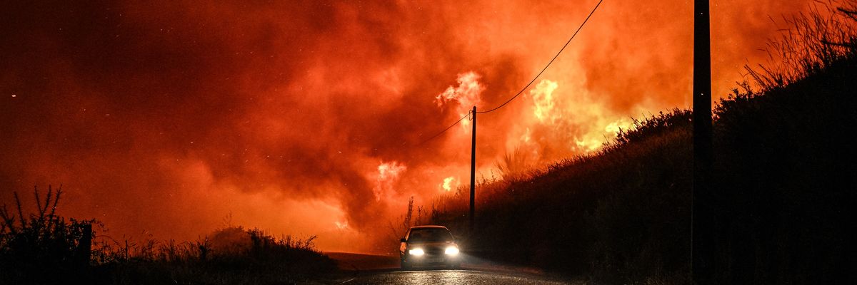 Residents leave the village of Almofrela, Portugal by car