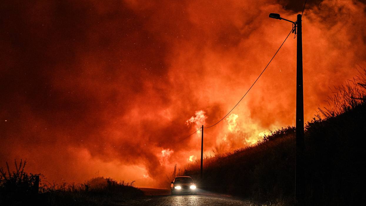Residents leave the village of Almofrela, Portugal by car