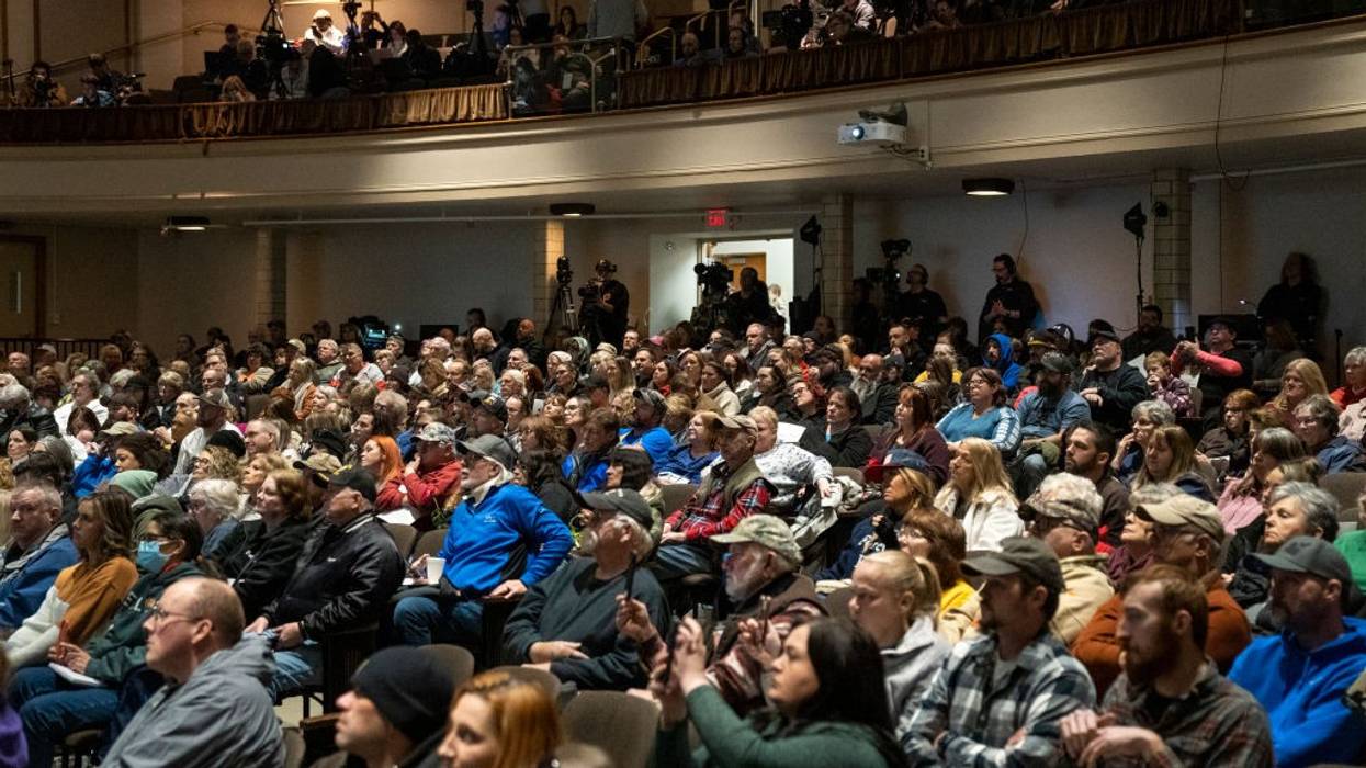 Residents listen as environmental activist Erin Brockovich speaks during a town hall at East Palestine High School on February 24, 2023 in East Palestine, Ohio.
