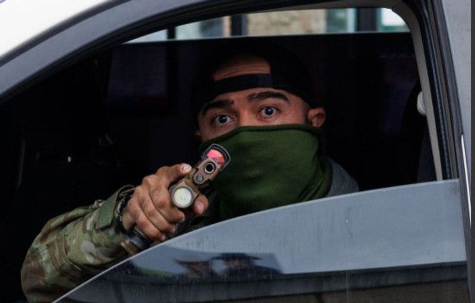 Response from a Chicago bounty hunter when a resident began filming him.