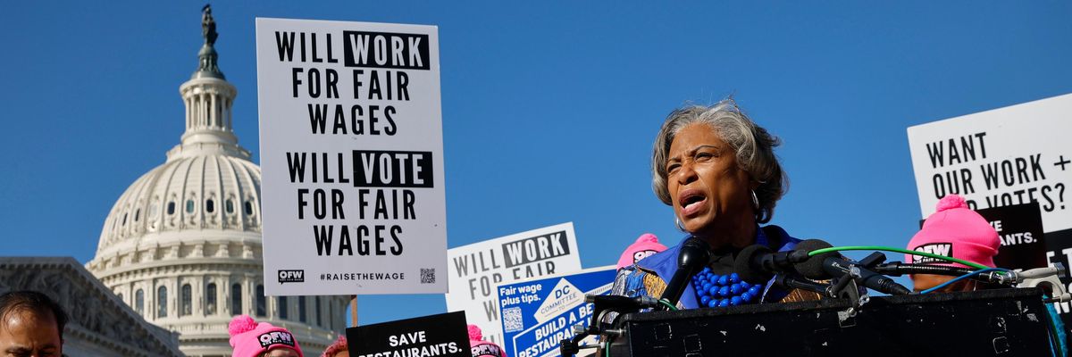 Restaurant workers attend a demonstration outside of Congress