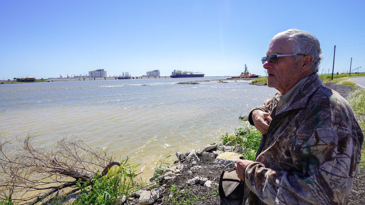 Retiree John Allaire stands in front of the Venture Global Calcasieu Pass liquefied natural gas export terminal in Cameron, Louisiana