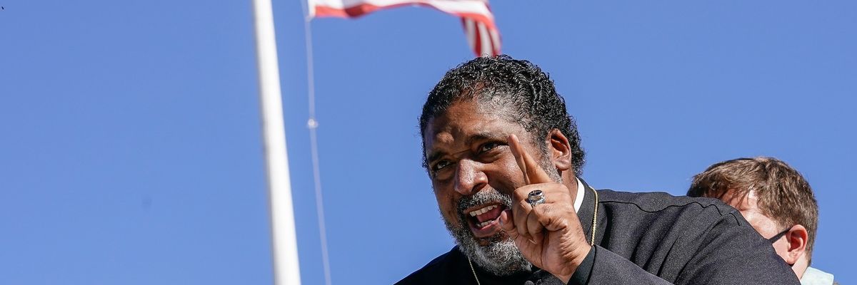 Rev. Dr. William Barber, co-chair of the Poor People's Campaign, speaks at a rally outside of the U.S. Supreme Court