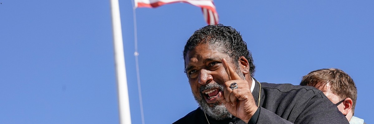 Rev. Dr. William Barber, co-chair of the Poor People's Campaign, speaks at a rally outside of the U.S. Supreme Court