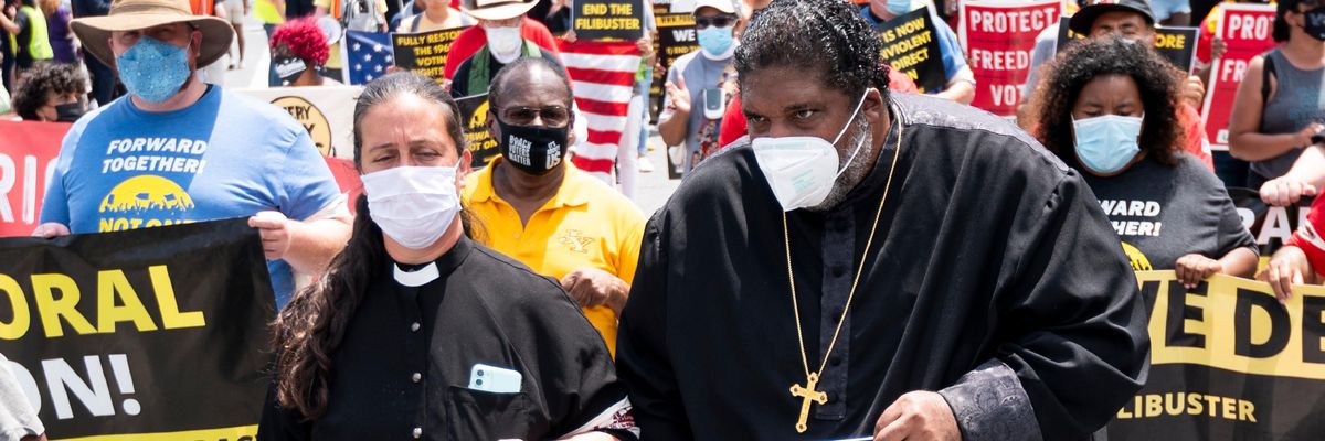 Rev. Dr. William J. Barber and Rev. Dr. Liz Theoharis lead a march in Washington, D.C.