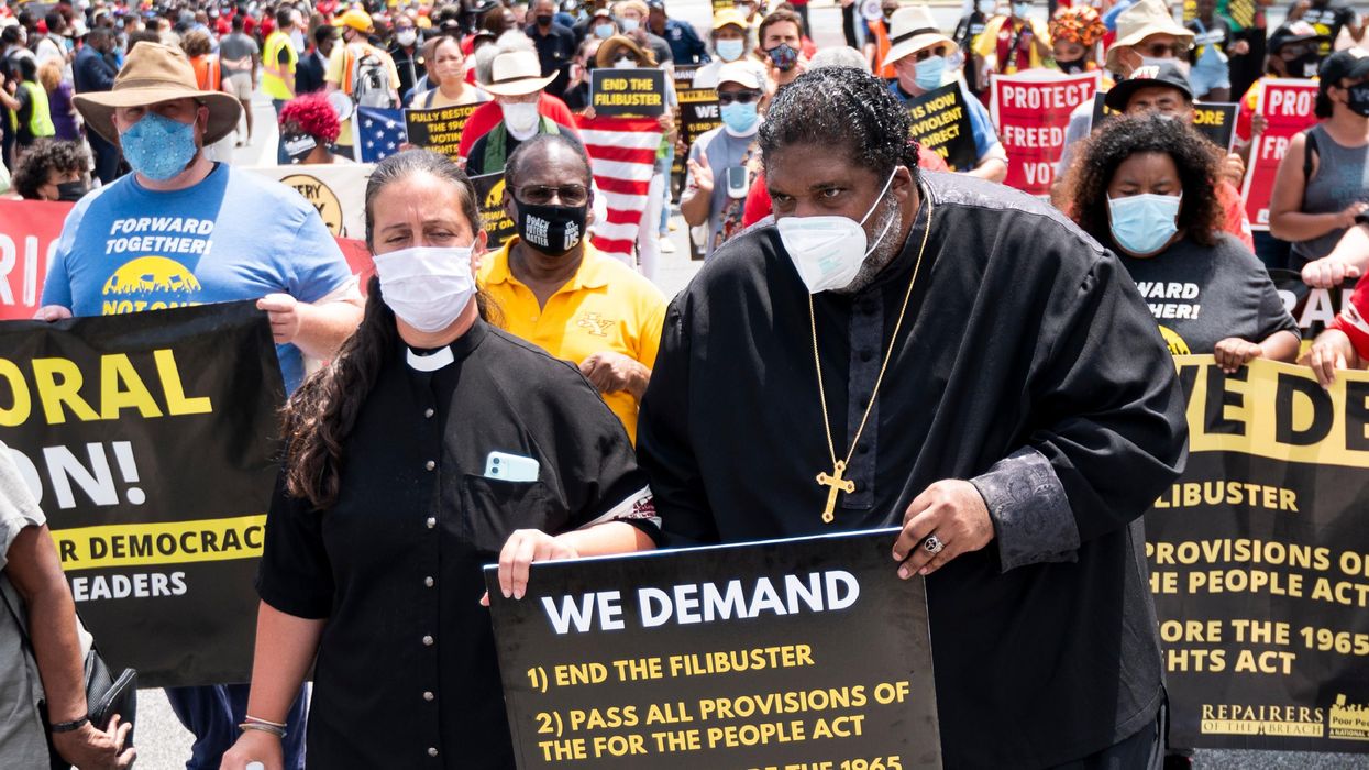 Rev. Dr. William J. Barber and Rev. Dr. Liz Theoharis lead a march in Washington, D.C.
