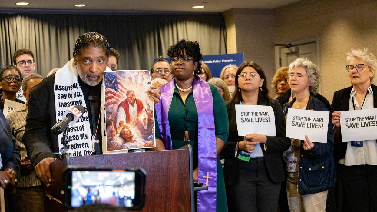 Rev. Dr. William J. Barber II with picture of Trump as Jesus