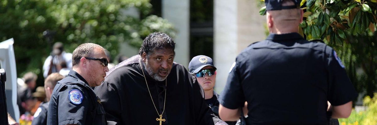 Rev. William Barber is arrested during a protest