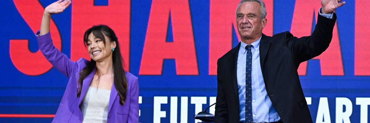RFK, Jr. and Nicole Shanahan wave at crowd.