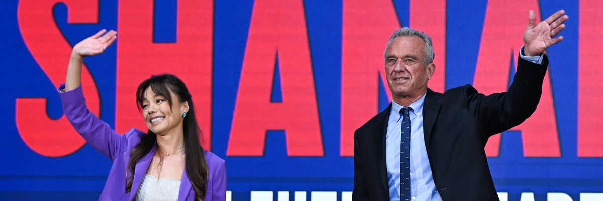RFK, Jr. and Nicole Shanahan wave at crowd.