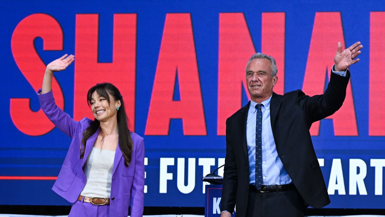 RFK, Jr. and Nicole Shanahan wave at crowd.
