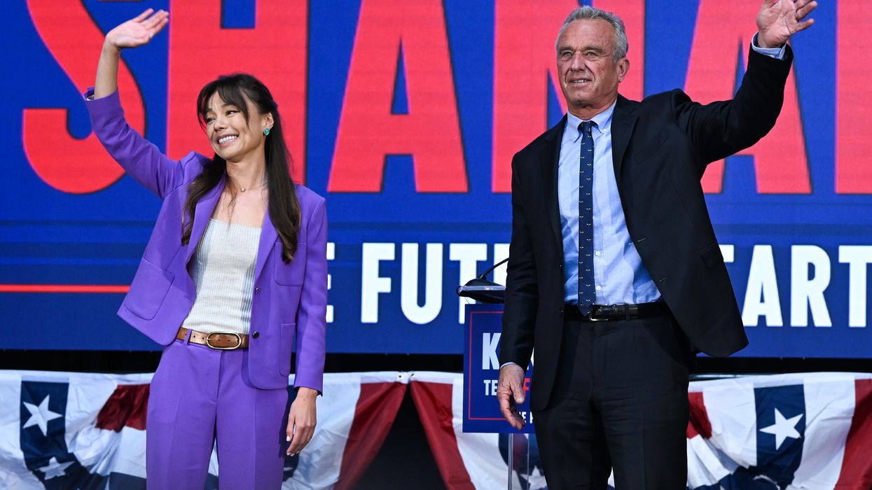 RFK, Jr. and Nicole Shanahan wave at crowd.