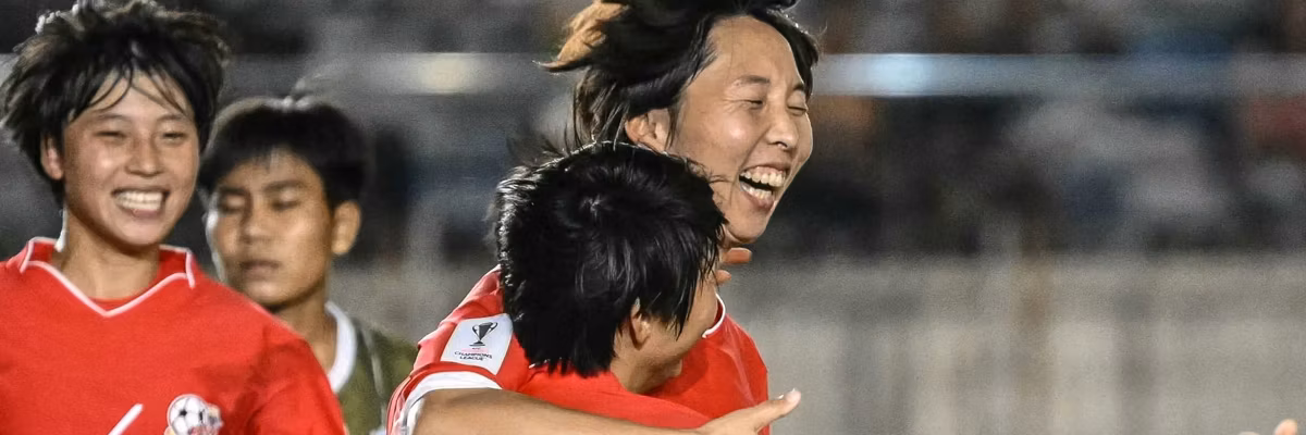 Ri Kum-Hyang (C, back) of Naegohyang Women's FC (PRK) celebrates with teammates
